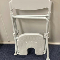 ALUMINIUM FOLDING SHOWER CHAIR WITH BACK SUPPORT AT INTERAKTIV HEALTH- in folded position